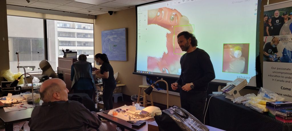 Instructor demonstrating a prosthodontic technique to delegates