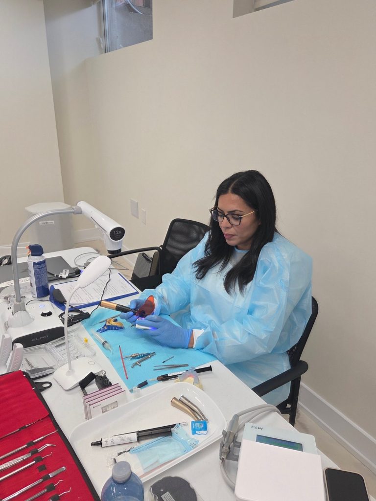 Delegate working on a case at a hands-on bench station